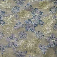 Golden Floral Jacquard Organza Fabric by Longan Craft features elegant purple floral patterns on sheer organza, perfect for dressmaking, with its delicate design allowing subtle background elements to show through.
