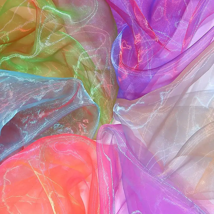 Longan Craft's Gradient Organza Fabric by the Yard features lightweight, ombre organza in pink, blue, purple, green, and orange. Its soft translucence and wavy textures are ideal for creating colorful modern bridal gowns.