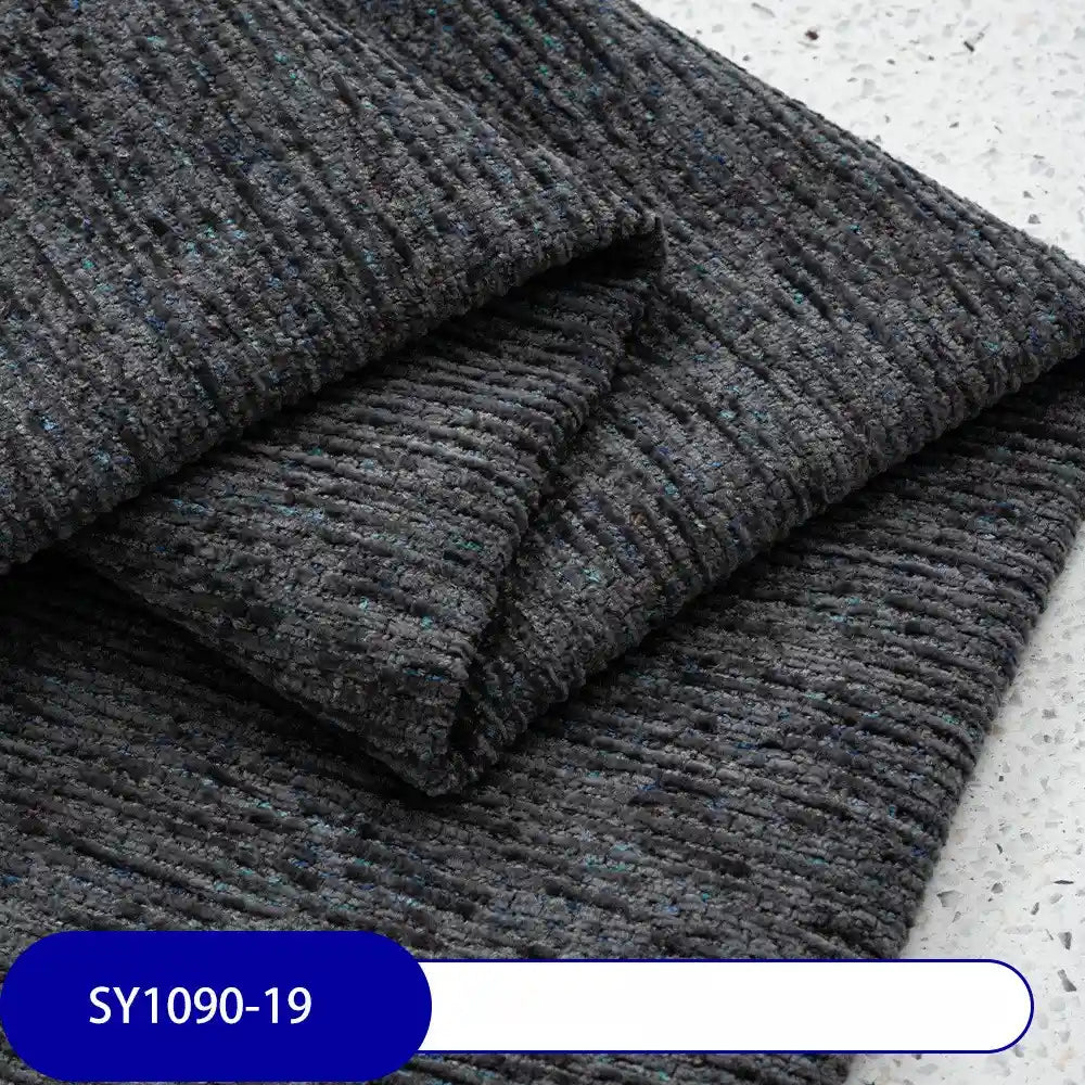 Close-up of Heavy Weight Slub Chenille Fabric By The Yard from Longan Craft, featuring thick, textured dark gray polyester with blue flecks (SY1090-19), ideal for modern interiors desiring premium heathered upholstery chenille.