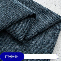 Close-up of folded dark blue Heavy Weight Slub Chenille Fabric by Longan Craft, showing horizontal ridges on a light speckled surface. Label at bottom left reads SY1090-20. This is premium thick polyester chenille upholstery fabric by the yard.