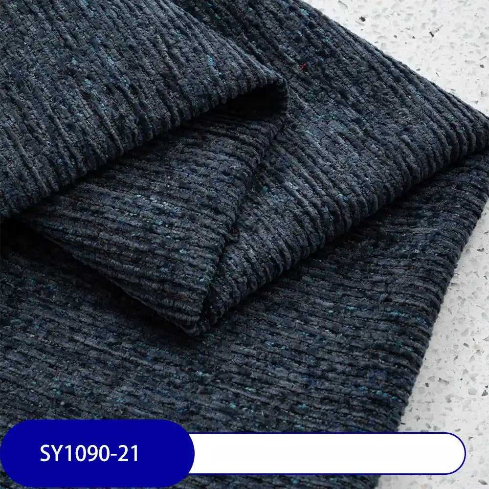 A close-up of Longan Craft’s Heavy Weight Slub Chenille Fabric By The Yard, folded neatly to show subtle blue flecks. A label reading SY1090-21 appears at the bottom left—ideal for premium chenille upholstery projects.