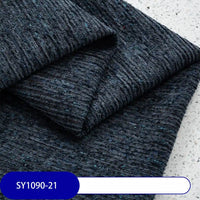 A close-up of Longan Craft’s Heavy Weight Slub Chenille Fabric By The Yard, folded neatly to show subtle blue flecks. A label reading SY1090-21 appears at the bottom left—ideal for premium chenille upholstery projects.