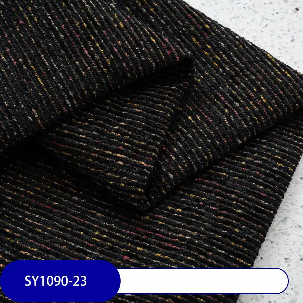 A close-up of folded Heavy Weight Slub Chenille Fabric by Longan Craft, featuring fine colorful specks and horizontal ridges on thick polyester chenille. A blue label reads SY1090-23—perfect for premium upholstery projects.