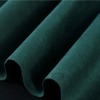 Close-up of Longan Craft’s Heavyweight Microfiber Faux Suede Fabric by the yard, draped in soft, smooth folds to showcase its rich multicolor hues and plush, brushed microsuede texture—an ideal material for DIY clothing projects.
