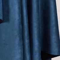 Close-up of Longan Craft’s Heavyweight Microfiber Faux Suede Fabric in dark blue, displaying its soft, gentle folds and brushed microsuede texture against a light background.
