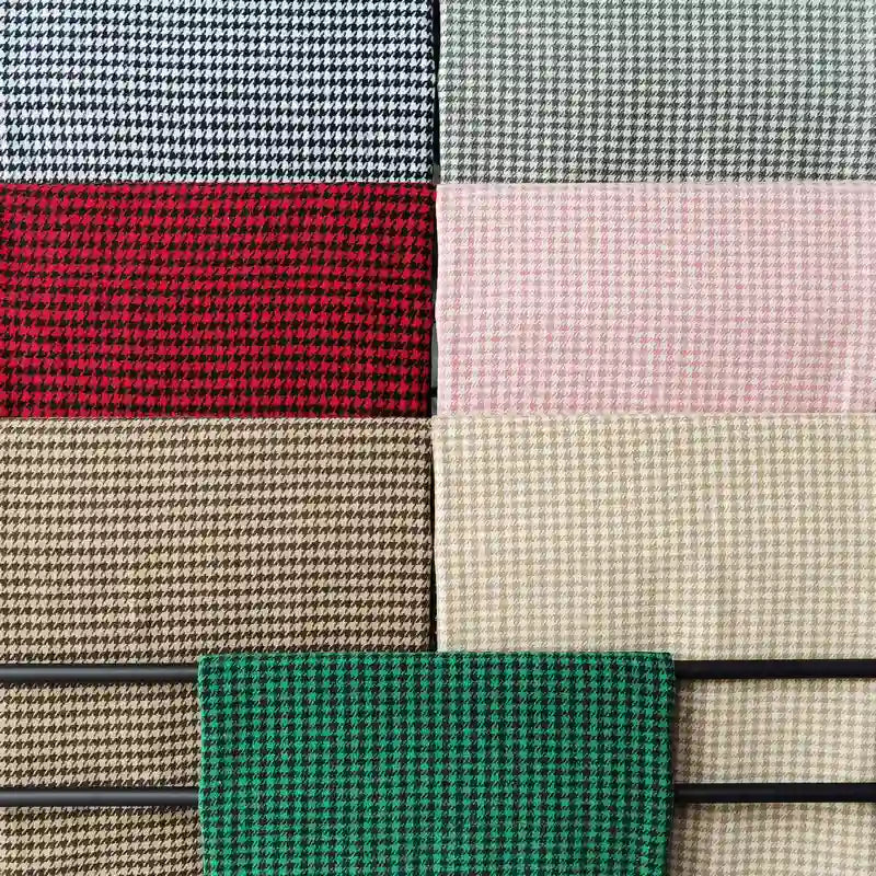 Eight Houndstooth Mammoth Flannel swatches by Longan Craft, shown in a grid of mixed colors—black & white, red & black, tan & brown, beige, green & black, and more—all made from soft brushed polyester cotton flannelette.