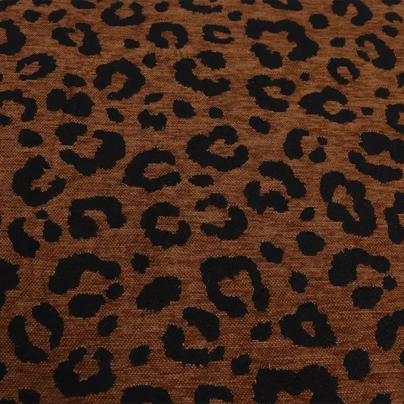 Leopard Jacquard Chenille Fabric By The Yard in brown with a repeating black animal print pattern.