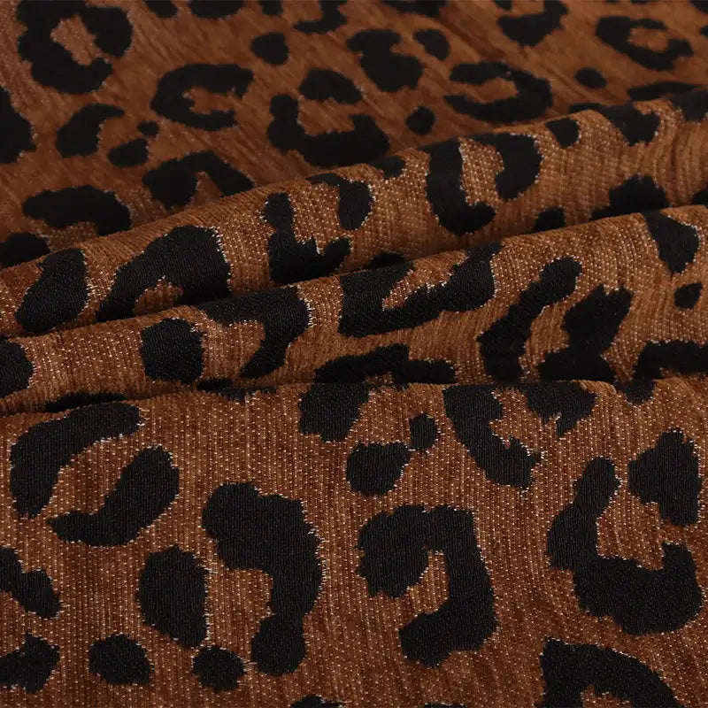 Leopard Jacquard Chenille Fabric By The Yard in brown with a black animal print pattern.