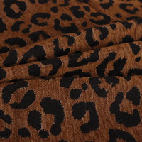 Leopard Jacquard Chenille Fabric By The Yard in brown with a black animal print pattern.