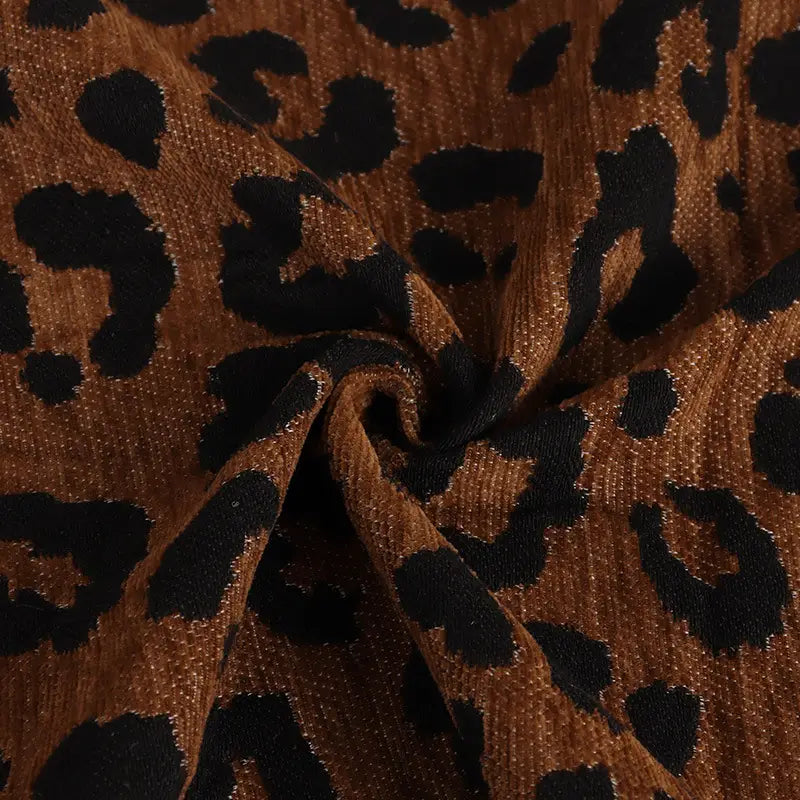 Brown Leopard Jacquard Chenille Fabric by the Yard bunched in the center.