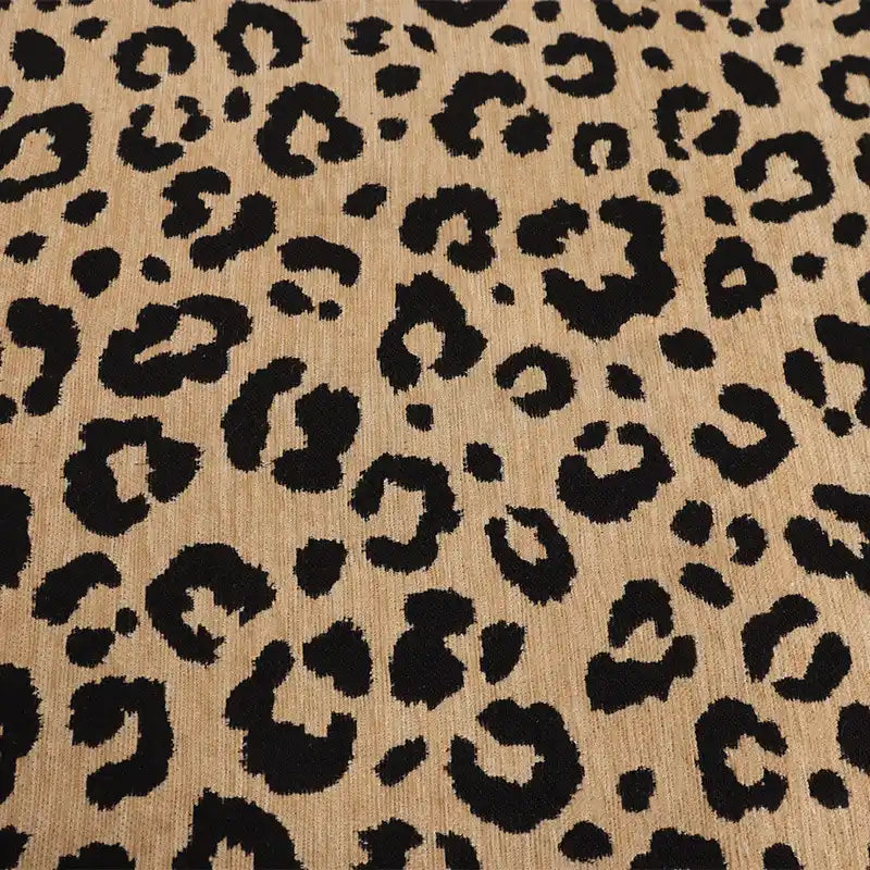 Leopard Jacquard Chenille Fabric By The Yard in tan with a black animal print pattern.