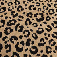 Leopard Jacquard Chenille Fabric By The Yard in tan with a black animal print pattern.