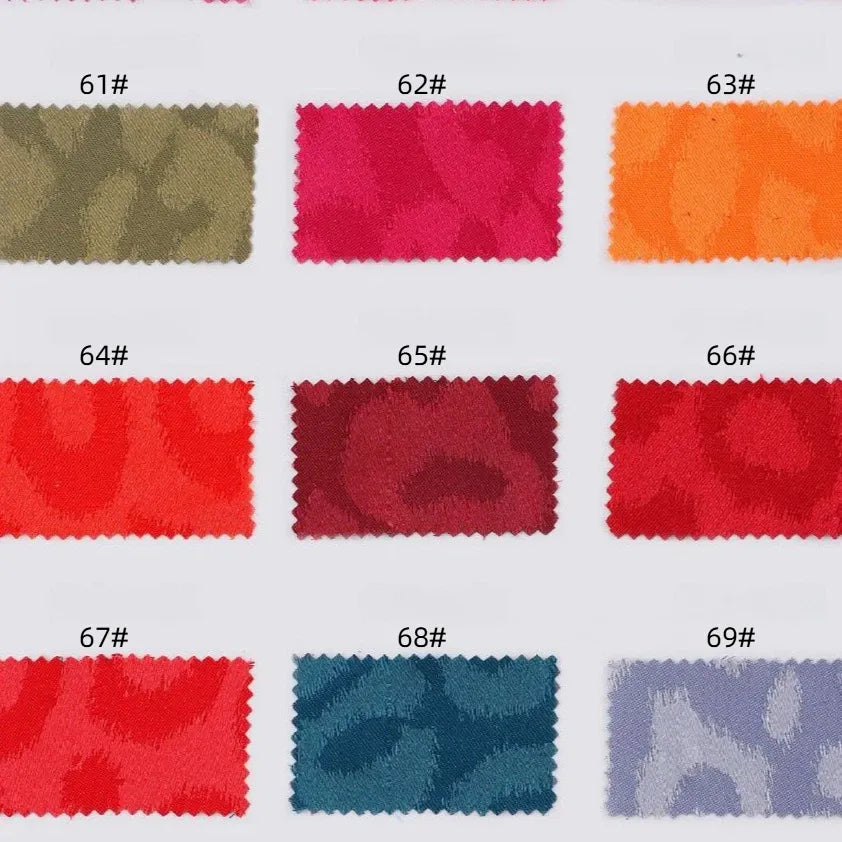 A sample card displays nine rectangular swatches (61#–69#) in various colors like olive green, pink, orange, and lavender. Each features a subtle animal jacquard pattern from Longan Craft's Leopard Jacquard Satin Fabric By The Yard.