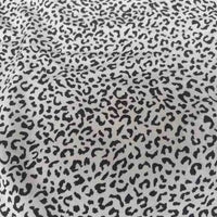 Leopard Print Chiffon Fabric By The Yard in a lightweight sheer material featuring a black leopard print pattern on a white background.