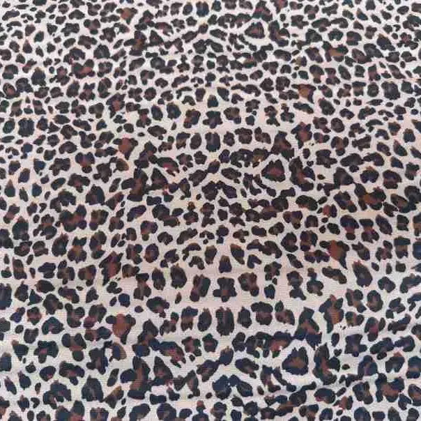 Leopard Print Chiffon Fabric By The Yard in a sheer brown and black animal print pattern.