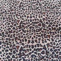 Leopard Print Chiffon Fabric By The Yard in a sheer brown and black animal print pattern.