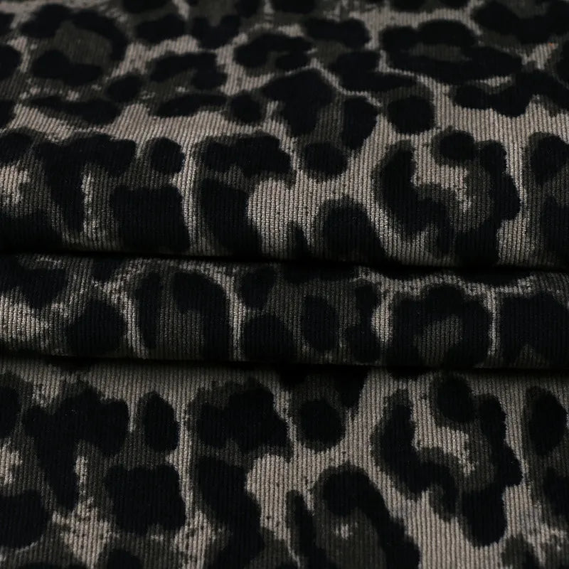 Close-up of Leopard Print Corduroy Fabric By The Yard from Longan Craft in multicolor, perfect for fashionable kids' clothing and other creative projects.