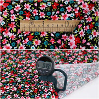 Two images of Longan Craft’s Lily Printed Cotton Corduroy Fabric: the first shows a ruler for scale; the second displays a digital caliper measuring this fine wale floral fabric’s thickness at 0.39 mm.