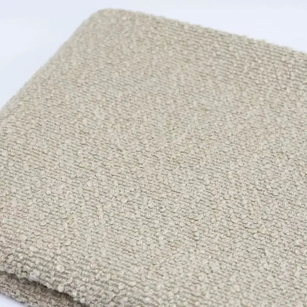Folded swatch of beige textured Linen Grain Boucle Fabric By The Yard.