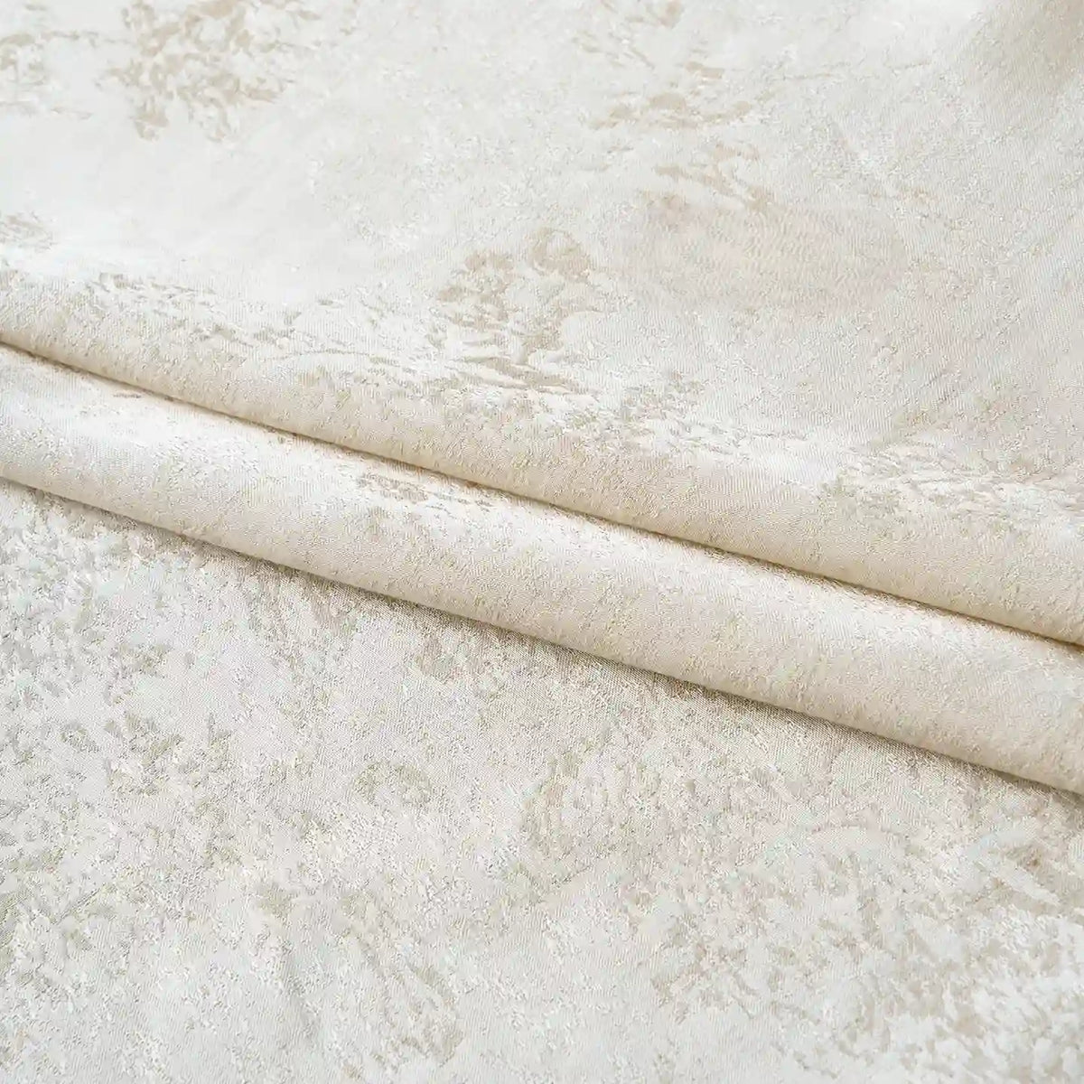 The Longan Craft Linen Viscose Jacquard Satin Fabric By The Yard features a light beige shade and a subtle, intricate floral pattern. Displayed neatly folded, this luxury rayon satin material showcases a soft texture with a gentle sheen, highlighting the delicate jacquard design—making it an elegant choice for dresses and special projects.