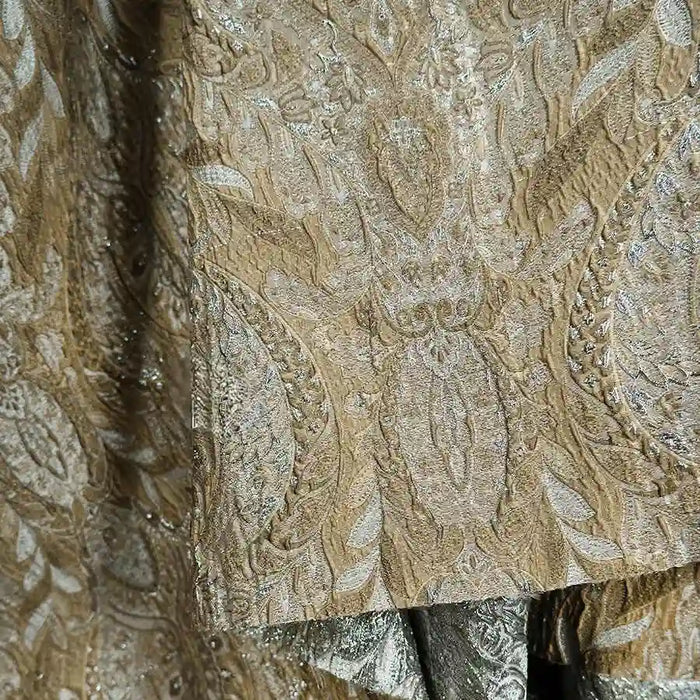 Close-up of Longan Craft's Luxury Embossed Brocade Fabric by the yard, featuring metallic jacquard with intricate floral and paisley patterns, rich texture, and shimmering threads for a premium, luxurious look.