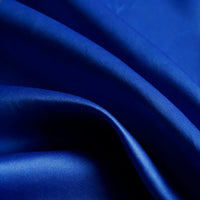 Close-up of Longan Craft Matte Satin Fabric by the yard, featuring soft texture and vibrant solid color with gentle folds—ideal for comfortable bridesmaid dresses and other elegant garments.