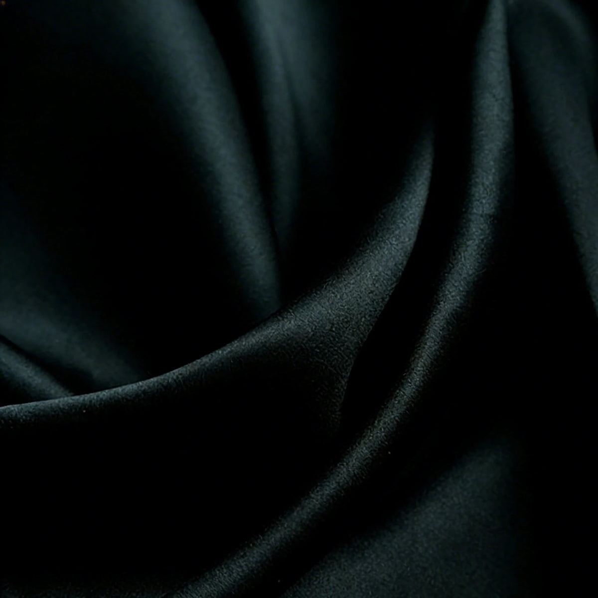 Close-up of Longan Craft Matte Satin Fabric By The Yard shows gentle folds and a soft sheen, highlighting the elegant, solid color satin texture ideal for bridesmaid dresses and comfortable fashion projects.