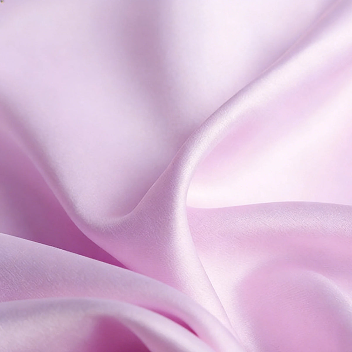 Close-up of Longan Craft’s Matte Satin Fabric By The Yard—smooth, light pink matte satin with gentle folds and a soft, elegant finish—ideal for comfortable bridesmaid dresses and wedding attire.