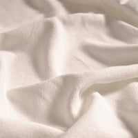 A close-up of Longan Craft’s Medium Weight Viscose Linen Fabric by the yard highlights its multicolor washed finish, gentle folds, breathable texture, and subtle weave—ideal as viscose clothing material.