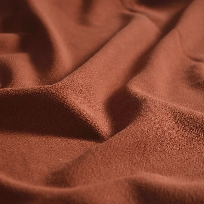 Close-up of Medium Weight Viscose Linen Fabric by Longan Craft, a breathable multicolor material with washed finish. Gentle folds highlight the soft crinkle texture and smooth, slightly matte surface—ideal for clothing projects.