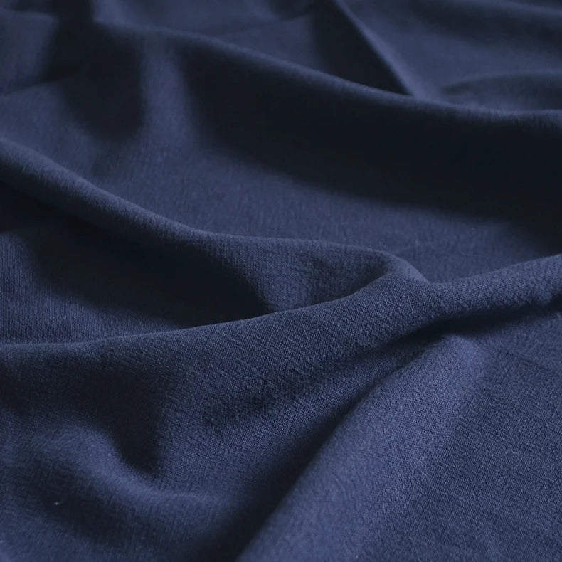 A close-up of Longan Craft’s Medium Weight Viscose Linen Fabric By The Yard shows its soft, breathable texture, washed finish, and gentle folds in multicolor, making it ideal for comfortable clothing.