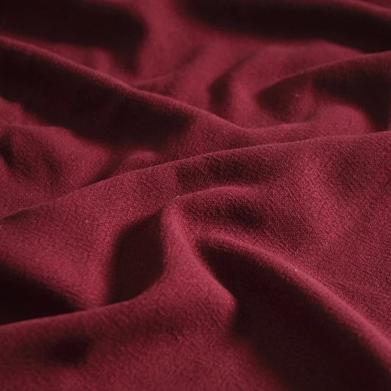 A close-up of Longan Craft’s medium weight multicolor viscose linen fabric by the yard, showing its soft washed finish, breathable texture, gentle folds, and natural shadows for added depth and warmth.