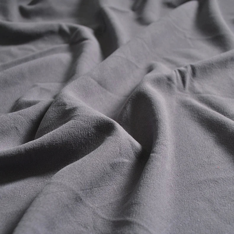 A close-up of Longan Craft’s Medium Weight Viscose Linen Fabric by the yard shows soft, multicolor material with a washed, crinkle texture and gentle folds—ideal breathable viscose clothing fabric.