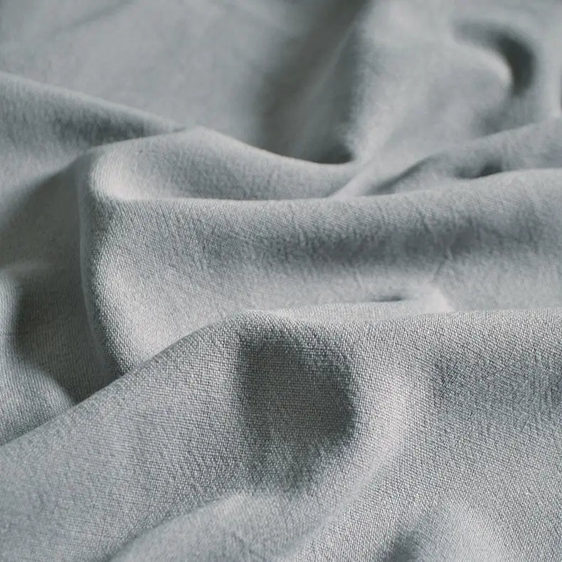 Close-up of Longan Craft’s Medium Weight Viscose Linen Fabric By The Yard, a multicolor, breathable clothing material with washed finish—showing its soft crinkle texture and gentle folds for a calming look.