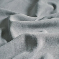 Close-up of Longan Craft’s Medium Weight Viscose Linen Fabric By The Yard, a multicolor, breathable clothing material with washed finish—showing its soft crinkle texture and gentle folds for a calming look.