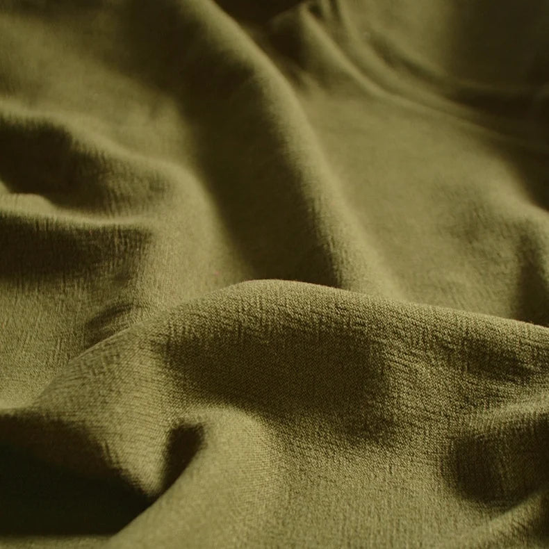 A close-up of Longan Craft’s Medium Weight Viscose Linen Fabric By The Yard shows its multicolor, washed finish and breathable texture, featuring soft folds with gentle shadows and highlights. Ideal for viscose clothing material.