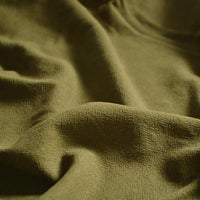 A close-up of Longan Craft’s Medium Weight Viscose Linen Fabric By The Yard shows its multicolor, washed finish and breathable texture, featuring soft folds with gentle shadows and highlights. Ideal for viscose clothing material.