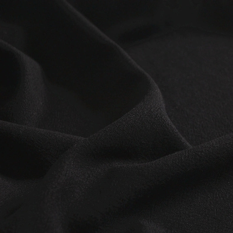 Close-up of Longan Craft’s Medium Weight Multicolor Viscose Linen Fabric by the yard, featuring a washed finish and soft, breathable texture with subtle folds and shadows.