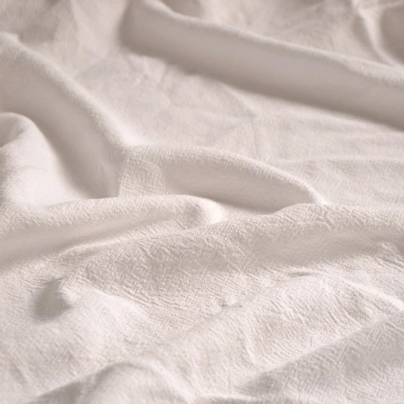 Close-up of Longan Craft’s Medium Weight Viscose Linen Fabric By The Yard featuring a breathable, multicolor fabric with washed finish and subtle textured folds that create depth and soft shadows—ideal for comfortable clothing.