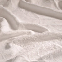 Close-up of Longan Craft’s Medium Weight Viscose Linen Fabric By The Yard featuring a breathable, multicolor fabric with washed finish and subtle textured folds that create depth and soft shadows—ideal for comfortable clothing.
