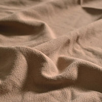 Close-up of Medium Weight Viscose Linen Fabric By The Yard from Longan Craft, showing its washed finish, visible texture, and gentle folds that create soft highlights and shadows on this multicolor breathable material.