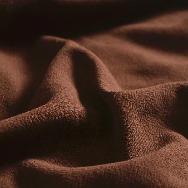 A close-up of Longan Craft's Medium Weight Viscose Linen Fabric By The Yard shows multicolor, breathable material with a washed finish, featuring gentle folds and visible texture ideal for viscose clothing projects.