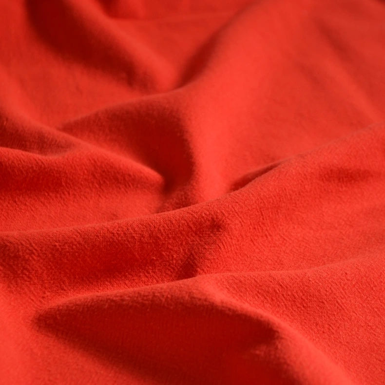 Close-up of Longan Craft Medium Weight Viscose Linen Fabric by the yard, showing its multicolor washed finish, breathable texture, and gentle folds that create appealing shadows and highlights—ideal for comfortable clothing.