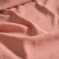 A close-up of Longan Craft's Medium Weight Viscose Linen Fabric By The Yard, featuring a multicolor washed finish and breathable, slightly textured surface with gentle folds.