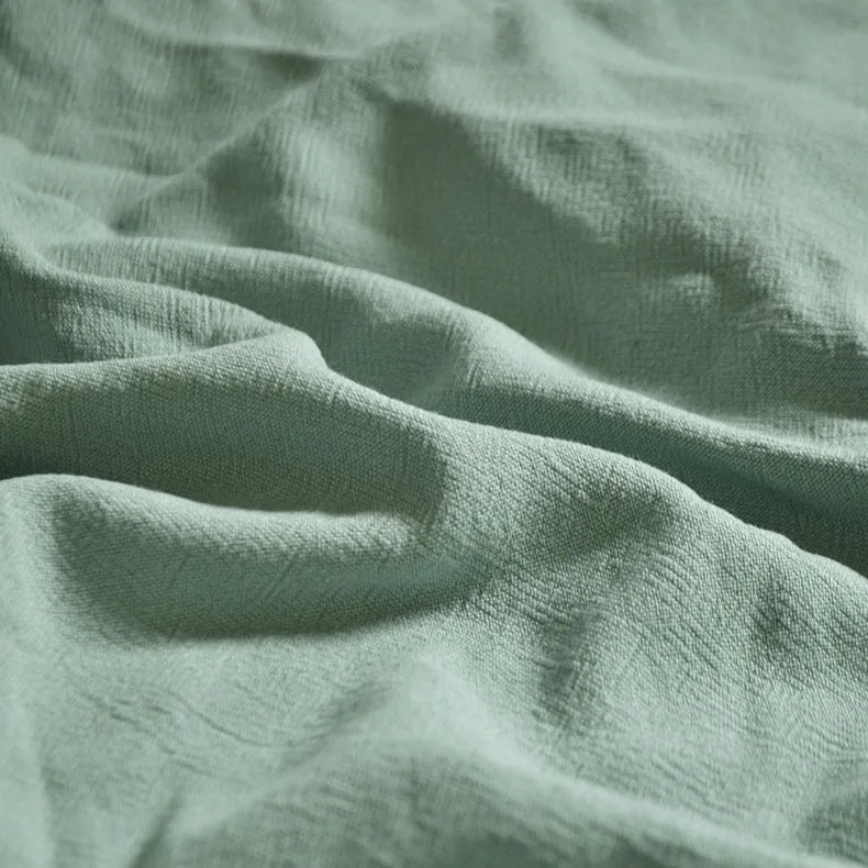 A close-up of Longan Craft's Medium Weight Viscose Linen Fabric By The Yard in multicolor, showing its washed finish, gentle folds, subtle texture, and smooth, breathable surface—ideal for airy viscose clothing material.