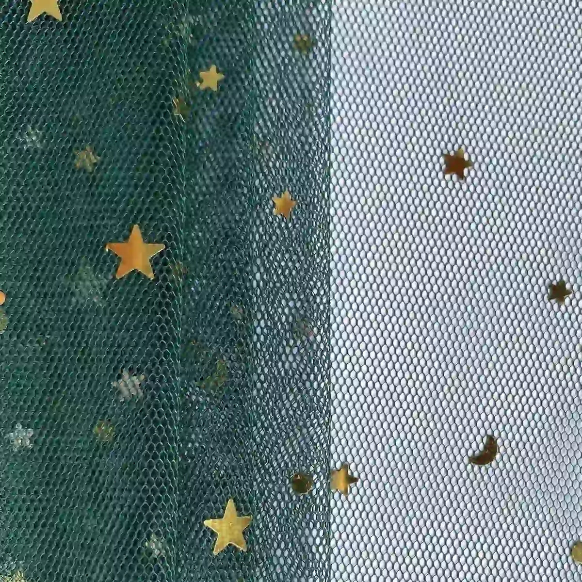 Close-up of Longan Craft’s Moon Star Sequins Tulle Fabric by the yard, featuring green and white sections with gold star and moon glitter—this multicolor tulle is perfect for stage costumes.