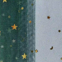 Close-up of Longan Craft’s Moon Star Sequins Tulle Fabric by the yard, featuring green and white sections with gold star and moon glitter—this multicolor tulle is perfect for stage costumes.