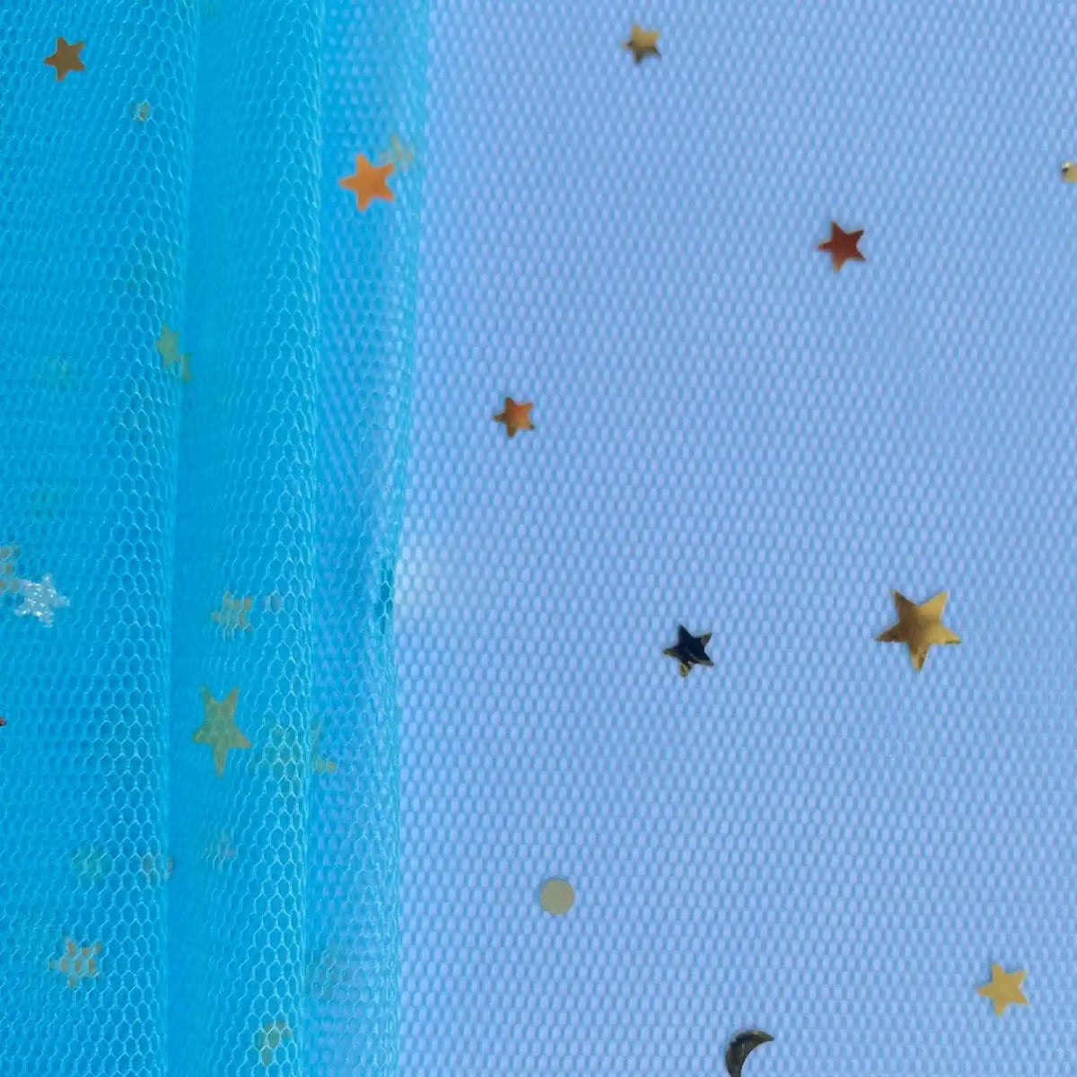 Moon Star Sequins Tulle Fabric by Longan Craft features multicolor glitter stars, dots, and crescent moons on blue mesh—perfect for stage costumes. Partially draped left side adds texture to this whimsical tulle material by the yard.