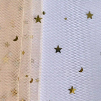 Longan Craft's Moon Star Sequins Tulle Fabric by the yard features multicolor glitter—ideal for stage costumes—shown draped over a white textured background with added gold star sequins on the right.