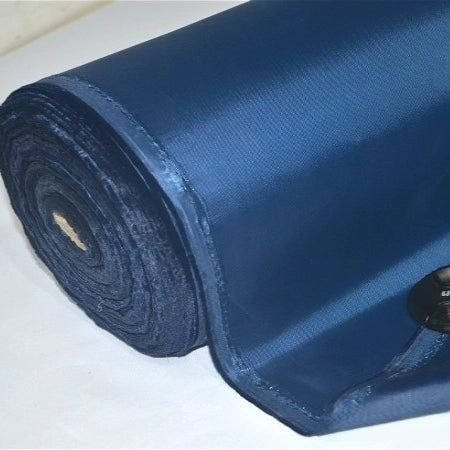 A close-up of a roll of Longan Craft Multicolor 300D PU Coated Polyester Oxford Fabric By The Yard, shown in dark blue on a white surface with a black button for scale—perfect for durable bags and backpacks.